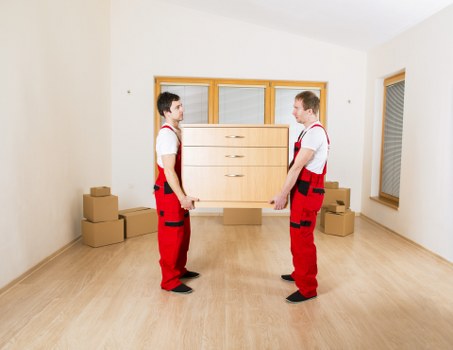 Boxes and furniture being organised in Battersea storage